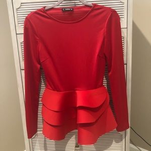 Red top with dramatic peplum